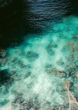 Clear Turquoise Water Over Rocks