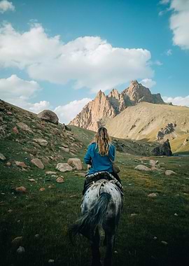 Woman Riding Horse in Mountain Landscape