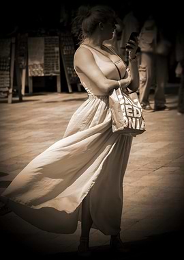 Woman in Dress Using Smartphone