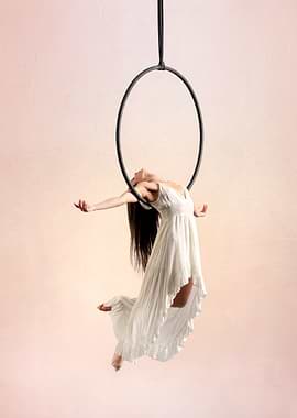 Aerial Hoop Artist in White Dress