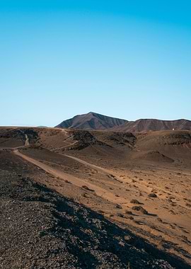 Desert Landscape with Mountains and Sky