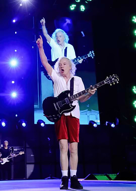 Angus Young performing on stage
