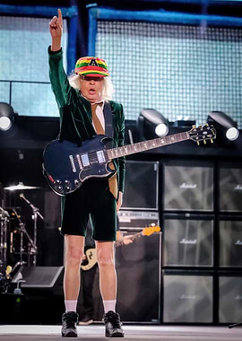 Angus Young performing live on stage