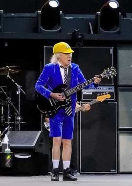 Angus Young performing with AC/DC