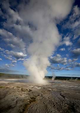 Dramatic Geyser Eruption Under Cloudy Skies