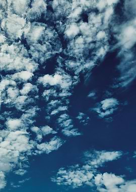 Scattered Clouds with a warm side to it.