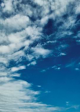 Bright Blue Sky with Wispy White Clouds