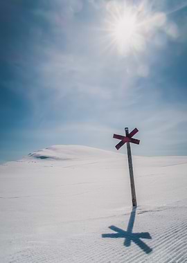 Winter landscape with trail marker