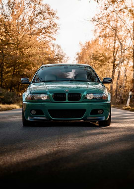 Green BMW on Autumn Road