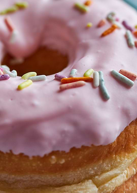 Pink frosted donut with sprinkles