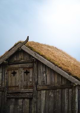 Old wooden house with grass roof