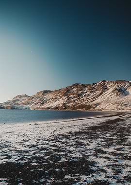 Snowy Landscape with Lake and Mountains