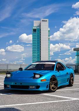 Blue Mitsubishi 3000GT with Hilton backdrop