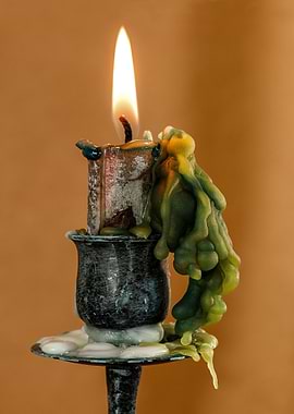 Burning Candle with Dripping Wax