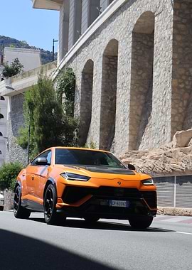 Orange Lamborghini Urus on City Street
