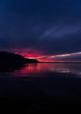Dramatic sunset over dark water