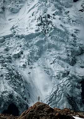 Person on rock with glacier backdrop