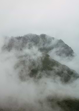 Mountain Peak Shrouded in Mist