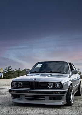 Gray BMW E30 on a Road