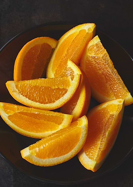 Orange Slices on Dark Plate