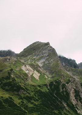 Green Mountain Peak Under Cloudy Sky