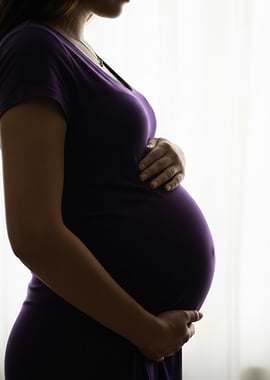 Pregnant Woman in Purple Dress