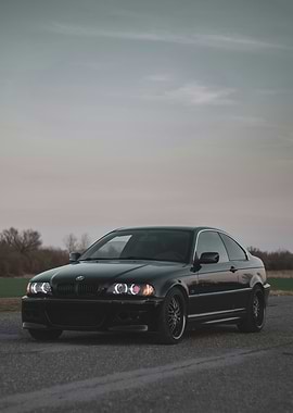 Black BMW Coupe on Asphalt Road