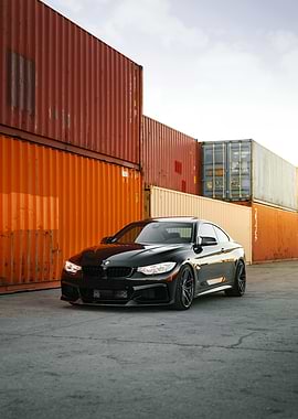 Black BMW in Industrial Setting