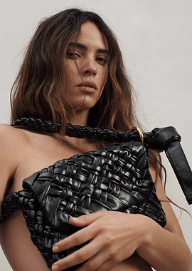 Woman with Black Woven Leather Bag