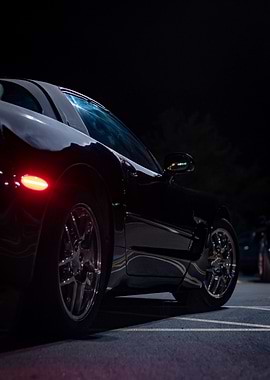 Sleek Black C5 corvette Sports Car at Night