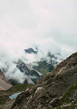 Mountainous Landscape with Clouds and Lake