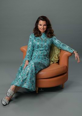 Fran Drescher in patterned turquoise dress
