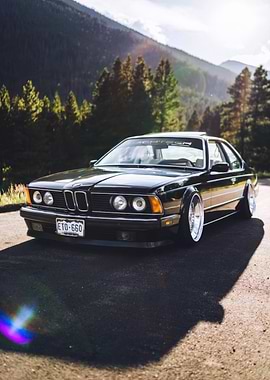 Black BMW E24 in Mountain Landscape