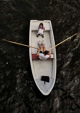 Rowboat with man and child