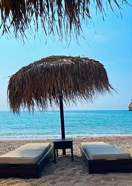 Beach Relaxation with Straw Umbrella