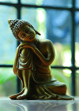 Meditative Buddha Statue by the Window