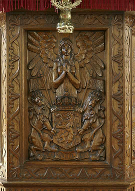 Ornate Wood Carving with Angel and Lions