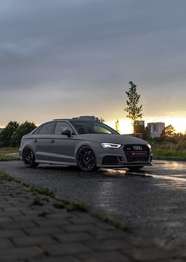 Gray Audi RS3 Sedan on Wet Road