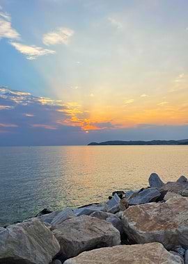Sunset over the sea with rocks