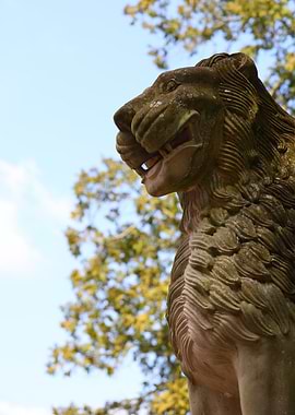 Stone Lion Statue Against Sky in Nara, Japan