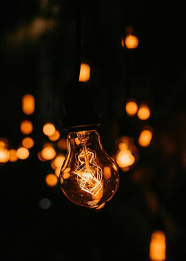 Glowing Light Bulb in Dark Setting