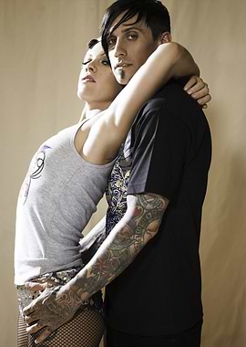 Tattooed couple portrait in studio