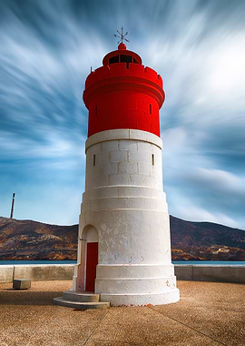 Red and White Lighthouse by the Sea