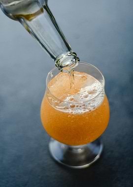 Pouring Beer into Glass