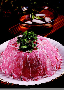 Meat mountain with herbs and broth