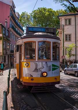 Lisbon Tram on Cobblestone Street
