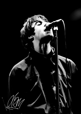 Liam Gallagher singing into microphone, black and white