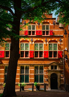Historic Brick Building with Red Shutters