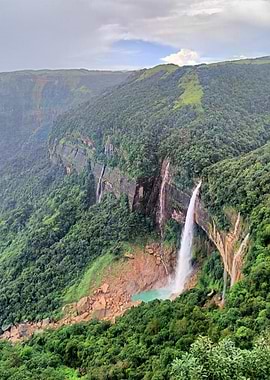 Majestic Waterfall in Lush Green Landscape