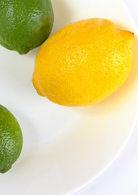 Lemon and Limes on White Plate